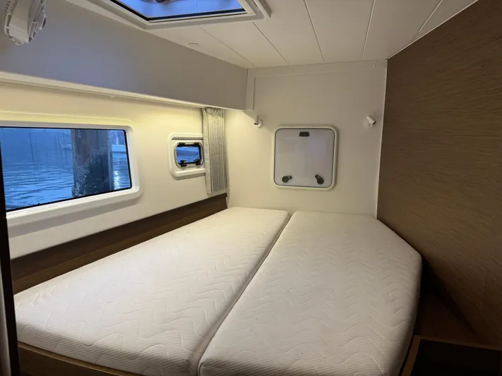 Catalina Breeze Yacht Photos Pics Interior cabin of 2022 Lagoon 42 catamaran with double bed and windows.