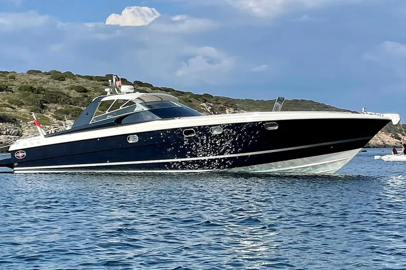  Yacht Photos Pics 1998 Otam Cigarette 45 Heritage yacht cruising on a scenic coastal waterway.