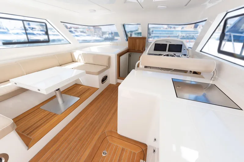 51 Fly Yacht Photos Pics Luxurious interior of 2025 Toy 51 Fly yacht with modern seating and navigation area.