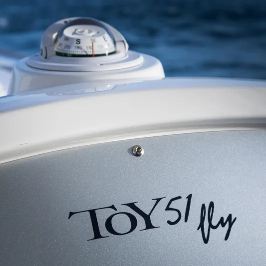 51 Fly Yacht Photos Pics Toy 51 Fly boat with compass, 2025 model, on a calm sea background.