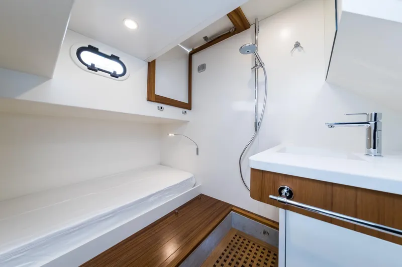 51 Fly Yacht Photos Pics Modern bathroom interior of 2025 Toy 51 Fly yacht, featuring sleek design and wooden accents.