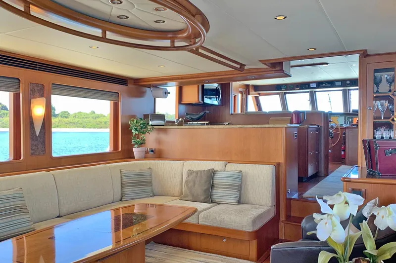 Bravo! Yacht Photos Pics Luxurious interior of 2012 Outer Reef Yachts 700 Motoryacht with elegant seating and scenic views.