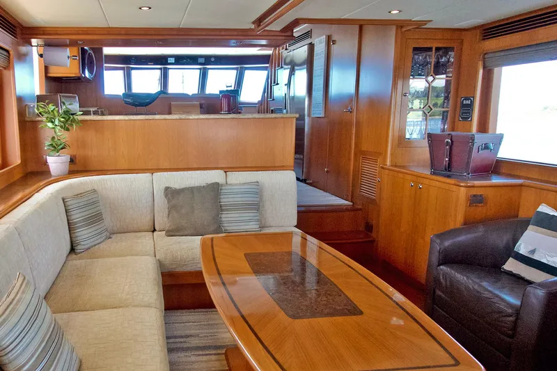 Bravo! Yacht Photos Pics Luxurious interior of 2012 Outer Reef Yachts 700 Motoryacht with elegant seating and wooden finishes.