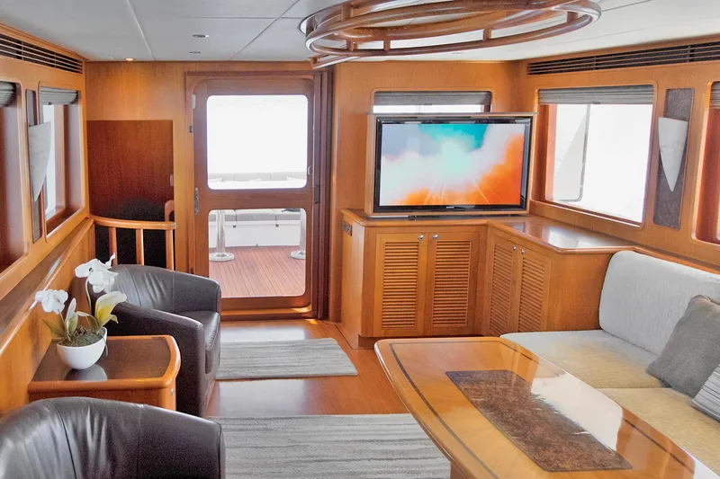 Bravo! Yacht Photos Pics Luxurious interior of 2012 Outer Reef Yachts 700 Motoryacht with modern furnishings and entertainment system.