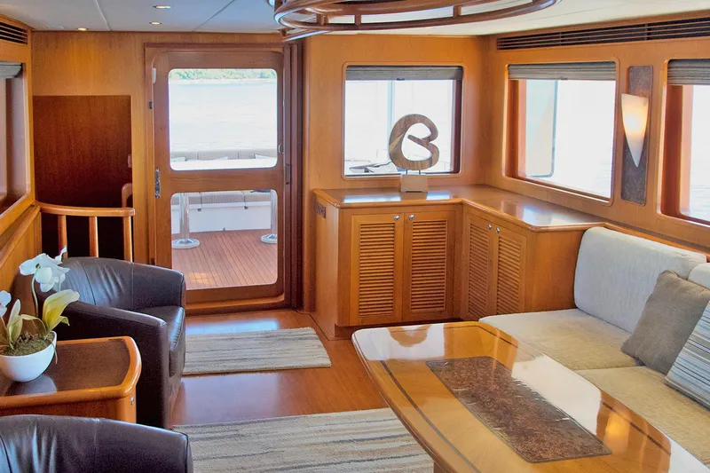 Bravo! Yacht Photos Pics Luxurious interior of 2012 Outer Reef Yachts 700 Motoryacht with elegant wood finishes.