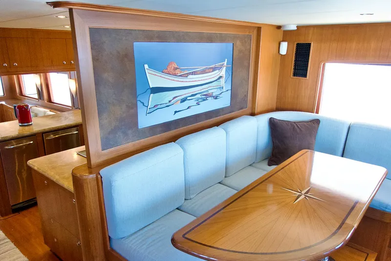 Bravo! Yacht Photos Pics Luxurious 2012 Outer Reef Yachts 700 Motoryacht interior with elegant dining area and artwork.