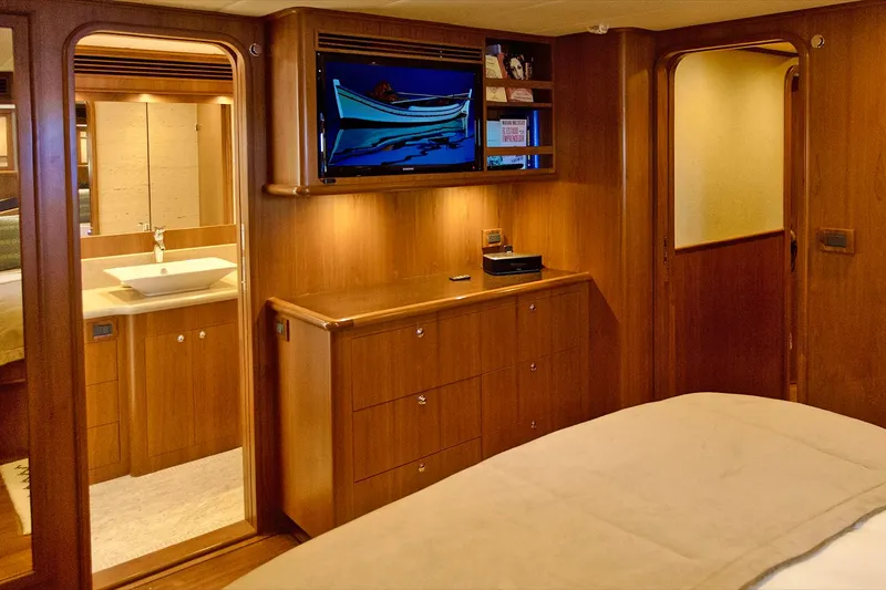 Bravo! Yacht Photos Pics Luxurious 2012 Outer Reef Yachts 700 Motoryacht interior with wood finish and modern amenities.