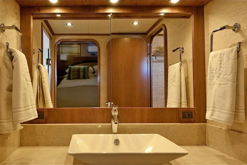 Bravo! Yacht Photos Pics Luxurious bathroom in 2012 Outer Reef Yachts 700 Motoryacht with elegant sink and mirror.