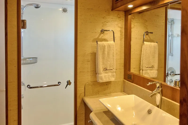 Bravo! Yacht Photos Pics Luxurious bathroom in 2012 Outer Reef Yachts 700 Motoryacht with modern sink and shower.