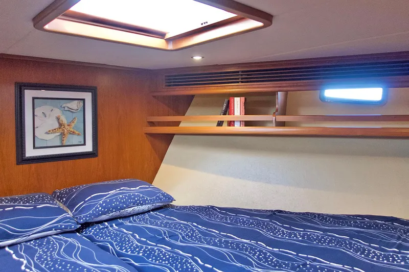 Bravo! Yacht Photos Pics Cozy bedroom in 2012 Outer Reef Yachts 700 Motoryacht with nautical decor and skylight.