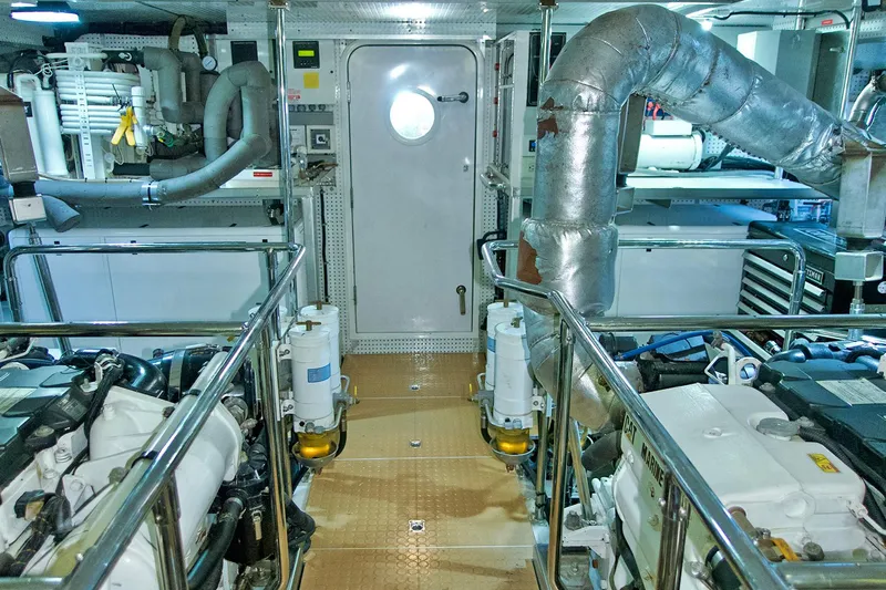 Bravo! Yacht Photos Pics Engine room of 2012 Outer Reef Yachts 700 Motoryacht, featuring advanced machinery and piping.