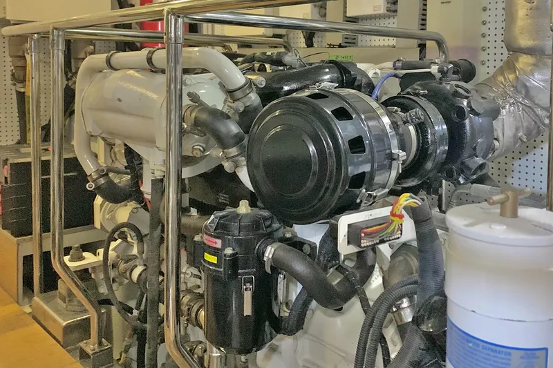 Bravo! Yacht Photos Pics Engine room of 2012 Outer Reef Yachts 700 Motoryacht, showcasing complex machinery and components.