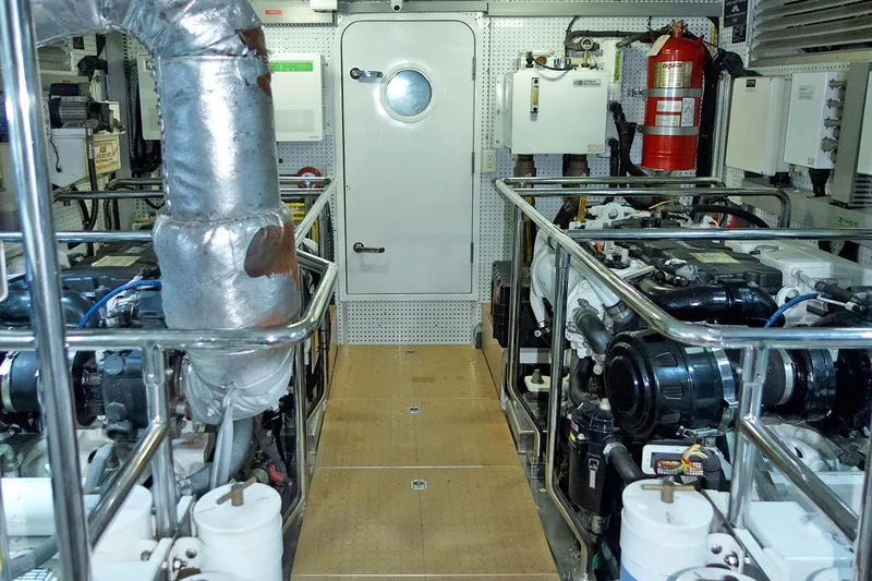 Bravo! Yacht Photos Pics Engine room of 2012 Outer Reef Yachts 700 Motoryacht, featuring machinery and safety equipment.