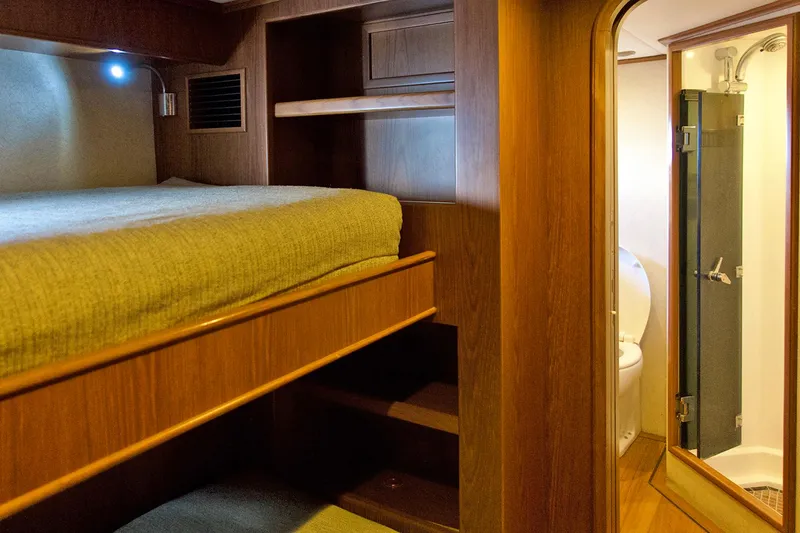 Bravo! Yacht Photos Pics Interior cabin of 2012 Outer Reef Yachts 700 Motoryacht with bunk bed and ensuite bathroom.