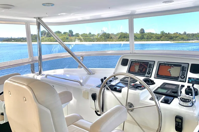 Bravo! Yacht Photos Pics Interior view of 2012 Outer Reef Yachts 700 Motoryacht helm with navigation equipment.