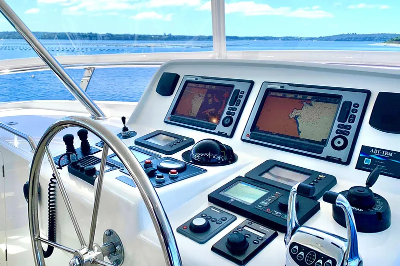 Bravo! Yacht Photos Pics Helm of 2012 Outer Reef Yachts 700 Motoryacht with navigation screens and controls.