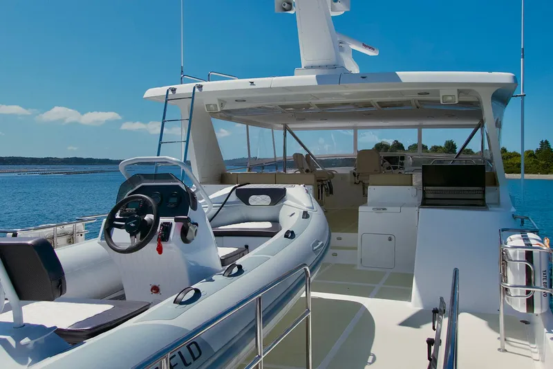 Bravo! Yacht Photos Pics 2012 Outer Reef Yachts 700 Motoryacht, spacious deck with seating, ocean view.