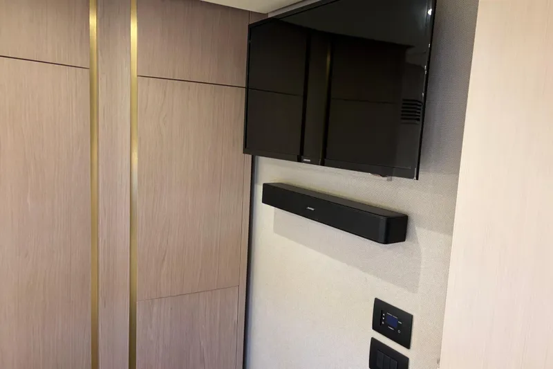 Fire Sale! Yacht Photos Pics Interior of 2020 Azimut 55 yacht with mounted TV and soundbar.