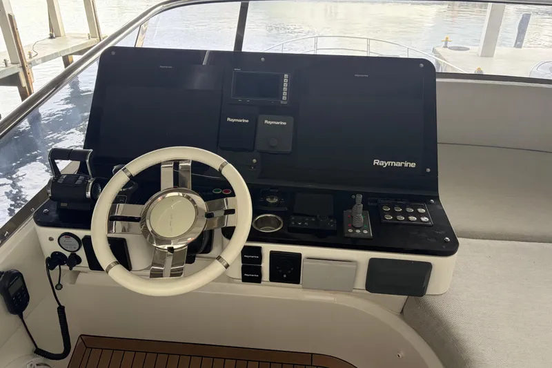 Fire Sale! Yacht Photos Pics Helm of 2020 Azimut 55 yacht with Raymarine navigation system and modern controls.