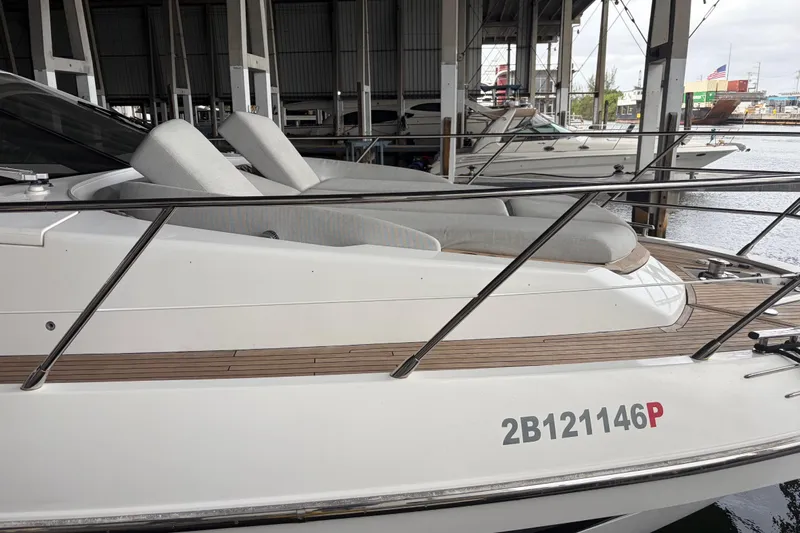 Fire Sale! Yacht Photos Pics 2020 Azimut 55 yacht docked, featuring sleek design and comfortable seating.