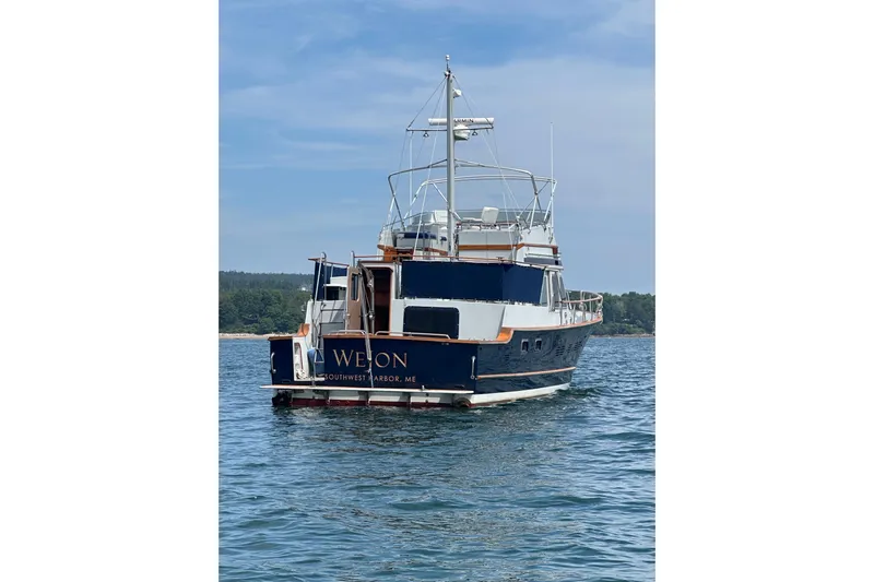  Yacht Photos Pics 1987 Albin North Sea Trawler on water, rear view, clear sky, Southwest Harbor, ME.
