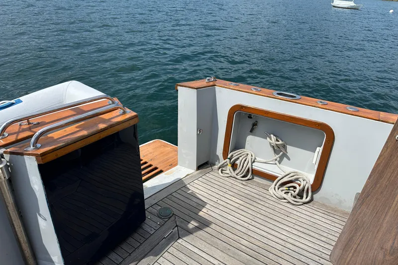  Yacht Photos Pics 1987 Albin North Sea Trawler deck with ropes, wooden accents, and ocean view.