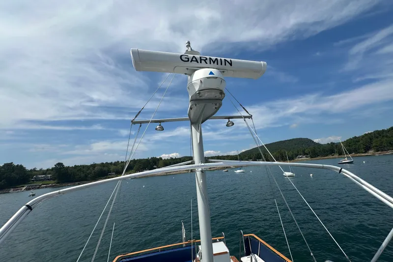  Yacht Photos Pics 1987 Albin North Sea Trawler with Garmin radar, anchored in scenic coastal waters.