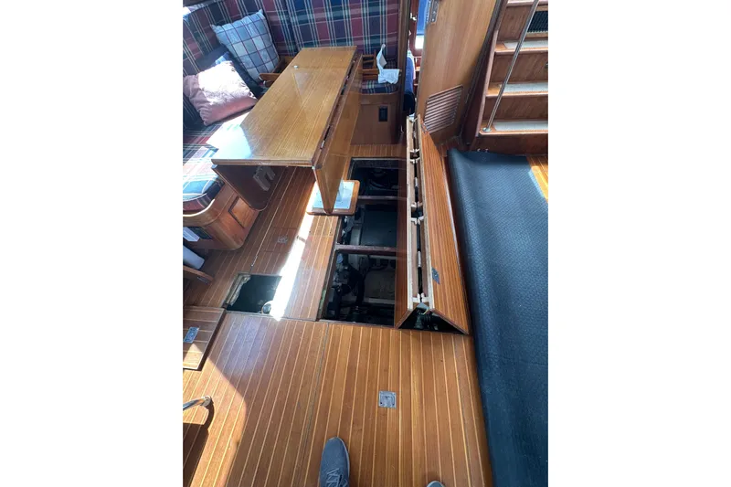 Yacht Photos Pics 1987 Albin North Sea Trawler interior with open floor panels revealing engine compartment.