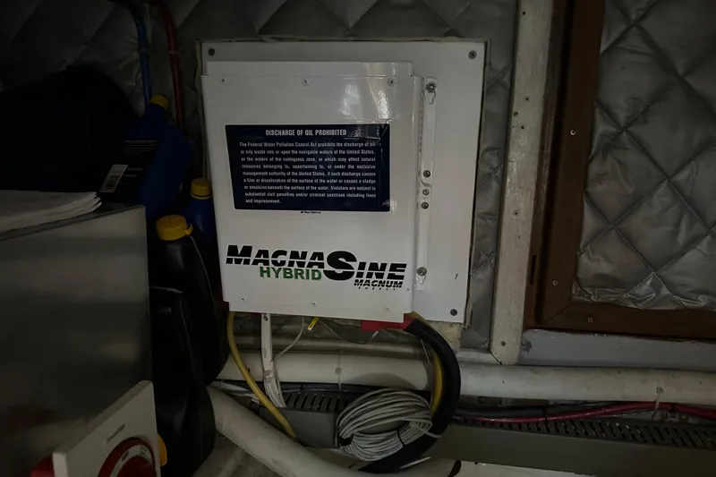  Yacht Photos Pics Electrical panel in 1987 Albin North Sea Trawler engine room with MagnaSine Hybrid inverter.