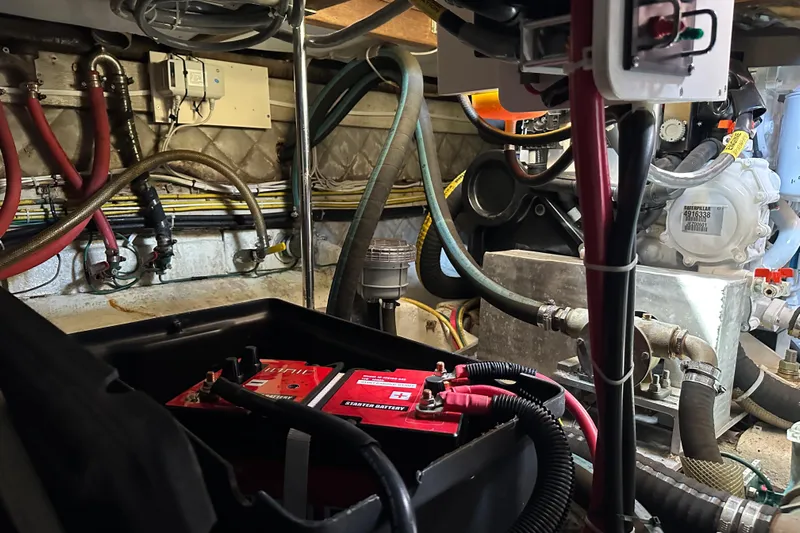  Yacht Photos Pics Engine room of 1987 Albin North Sea Trawler with visible wiring and battery.