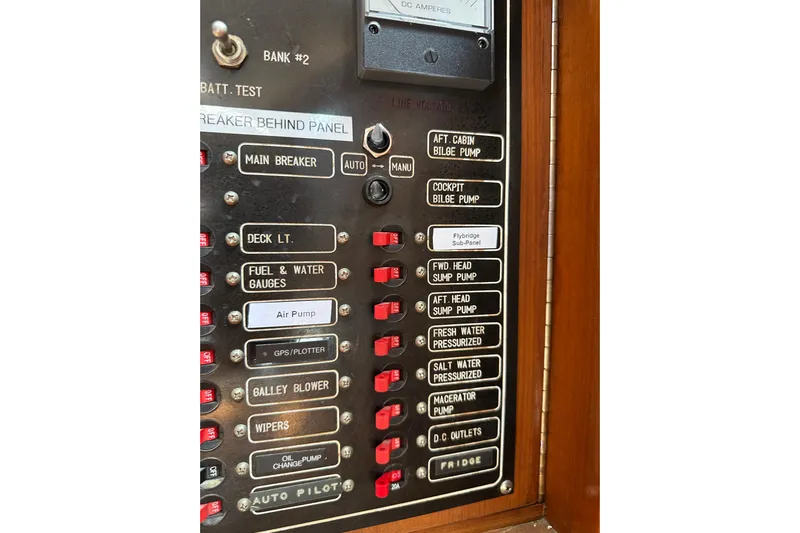 Yacht Photos Pics Control panel of a 1987 Albin North Sea Trawler with labeled switches and gauges.
