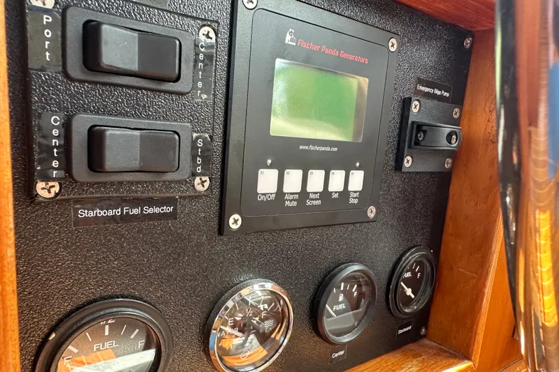  Yacht Photos Pics Control panel of a 1987 Albin North Sea Trawler with fuel gauges and switches.