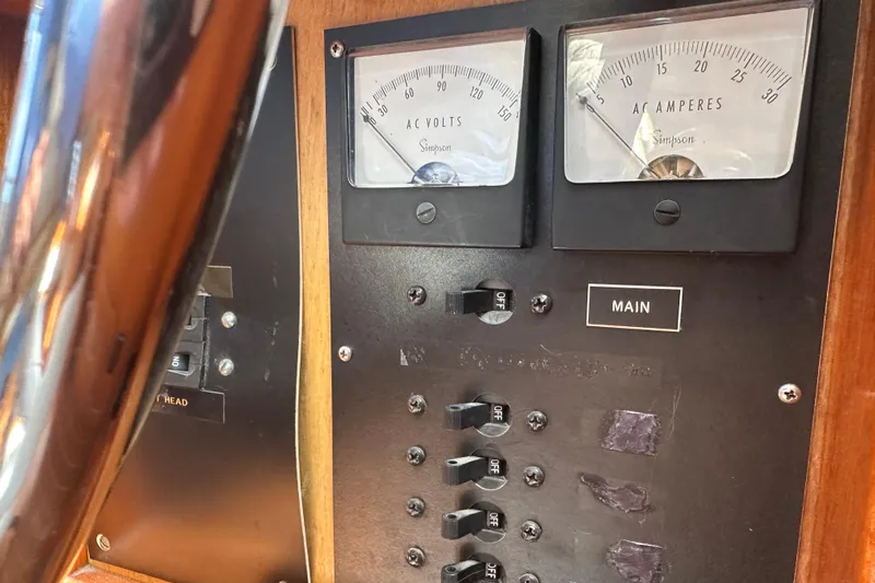  Yacht Photos Pics Control panel of a 1987 Albin North Sea Trawler with AC volt and ampere meters.