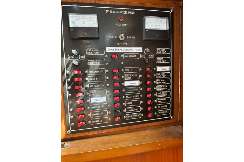  Yacht Photos Pics Control panel of a 1987 Albin North Sea Trawler with various switches and gauges.