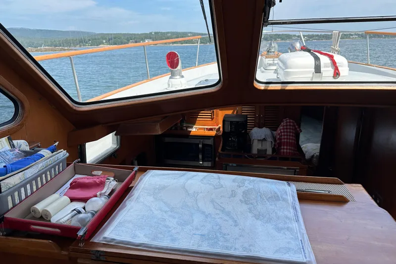  Yacht Photos Pics 1987 Albin North Sea Trawler interior with navigation map and sea view.