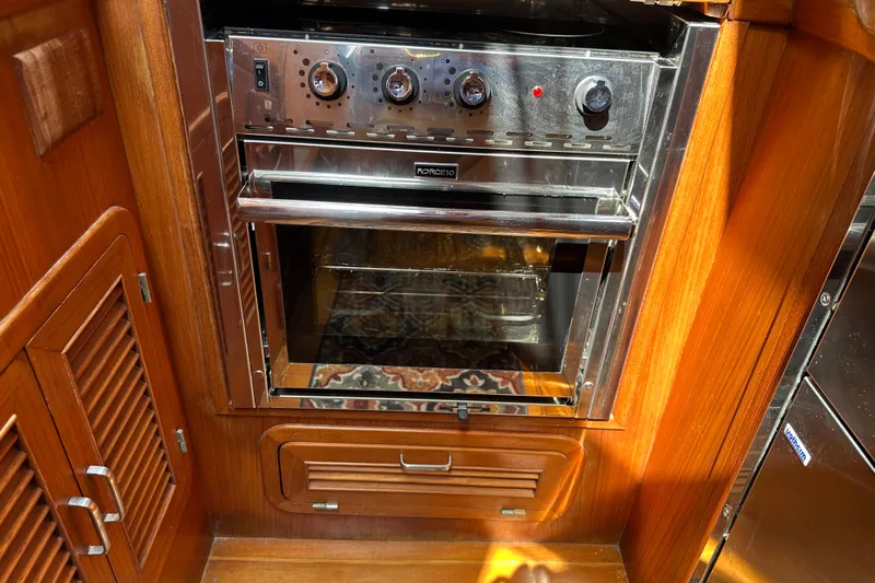  Yacht Photos Pics Wooden interior of 1987 Albin North Sea Trawler with built-in stainless steel oven.