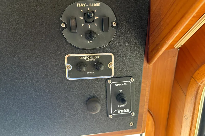  Yacht Photos Pics Control panel of a 1987 Albin North Sea Trawler with searchlight and windlass switches.