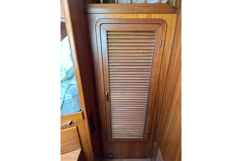  Yacht Photos Pics 1987 Albin North Sea Trawler wooden interior with louvered cabinet door.