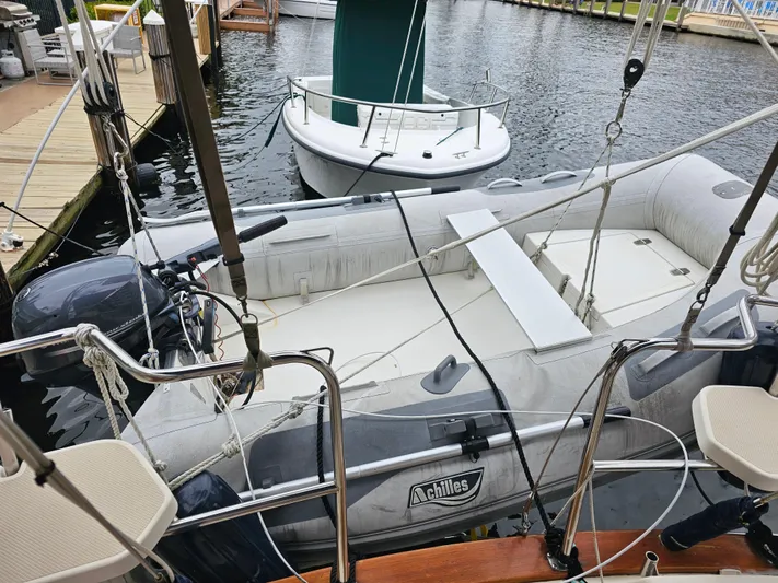 Moon River Yacht Photos Pics Inflatable dinghy on Island Packet 350 sailboat, 2002 model, docked at marina.