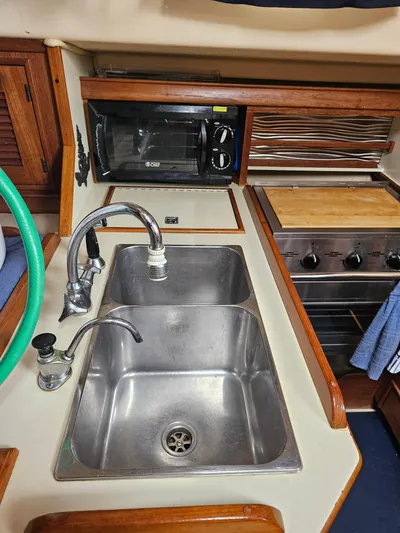 Moon River Yacht Photos Pics 2002 Island Packet 350 yacht kitchen with double sink and stove.