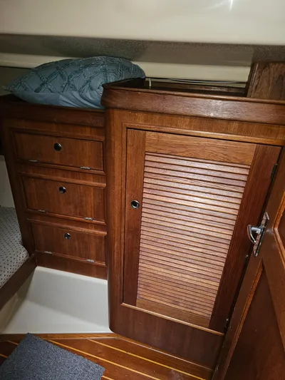 Moon River Yacht Photos Pics Interior of 2002 Island Packet 350 sailboat with wooden cabinetry and drawers.
