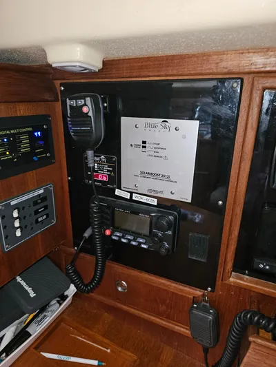 Moon River Yacht Photos Pics Control panel of a 2002 Island Packet 350 sailboat with communication equipment.