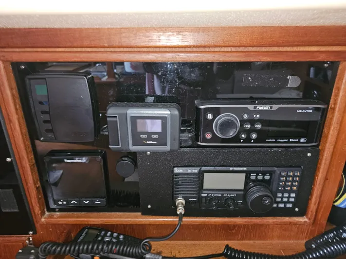 Moon River Yacht Photos Pics Control panel of a 2002 Island Packet 350 sailboat with navigation and communication equipment.