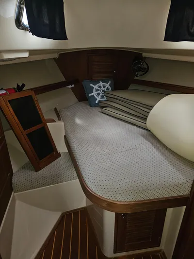 Moon River Yacht Photos Pics 2002 Island Packet 350 cabin interior with nautical decor and wooden accents.