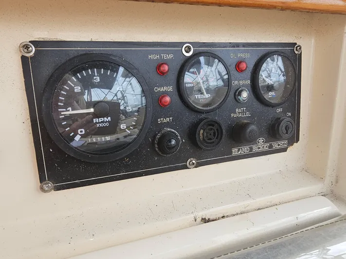 Moon River Yacht Photos Pics Control panel of a 2002 Island Packet 350 sailboat with RPM and temperature gauges.