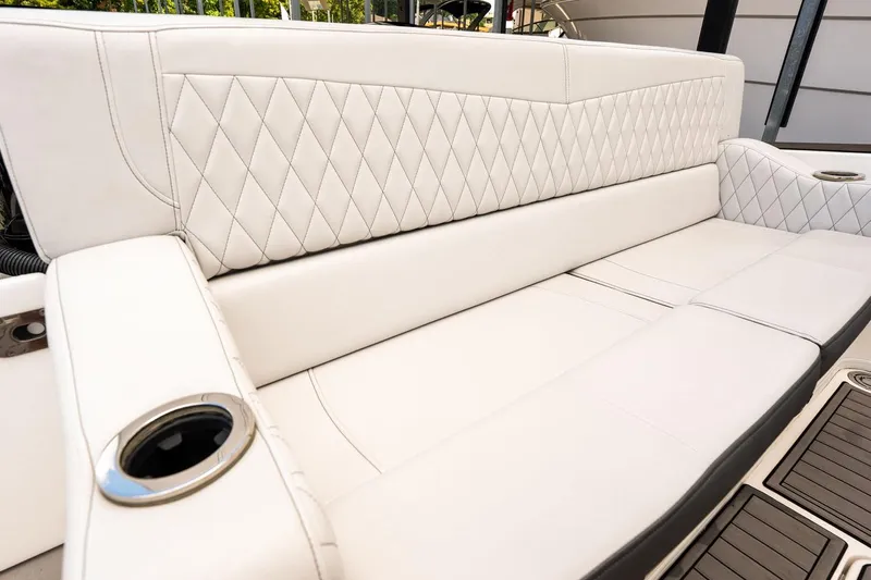  Yacht Photos Pics Luxurious white seating on 2018 Fountain 38 SCX boat with diamond stitching and cup holders.
