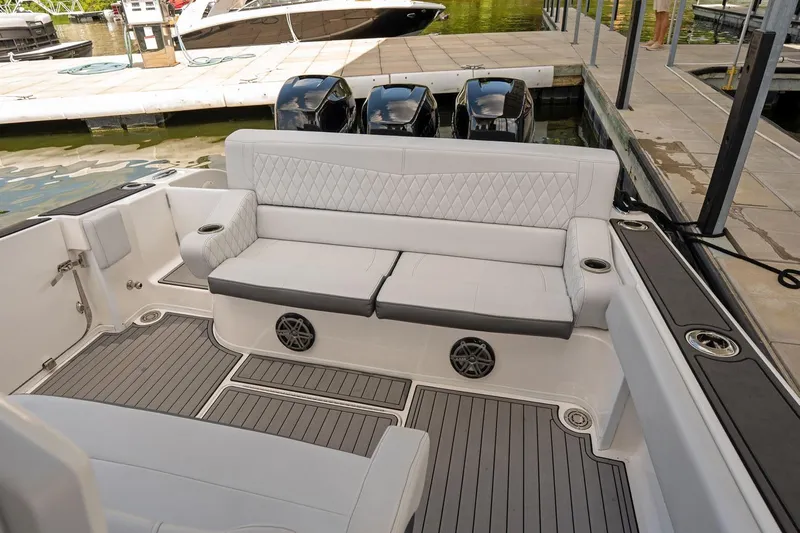  Yacht Photos Pics Luxurious seating area on a 2018 Fountain 38 SCX boat docked at a marina.