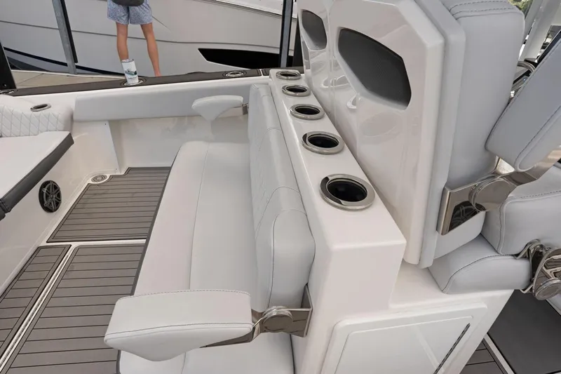  Yacht Photos Pics 2018 Fountain 38 SCX boat interior with cushioned seating and cup holders.