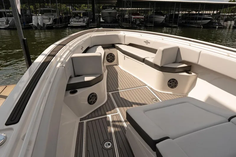  Yacht Photos Pics 2018 Fountain 38 SCX boat interior with cushioned seating and sleek design.