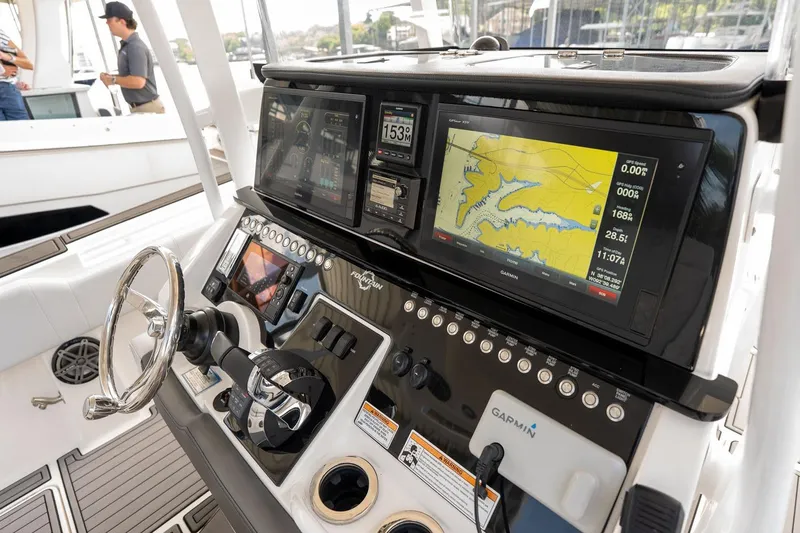  Yacht Photos Pics 2018 Fountain 38 SCX boat dashboard with Garmin navigation system and controls.